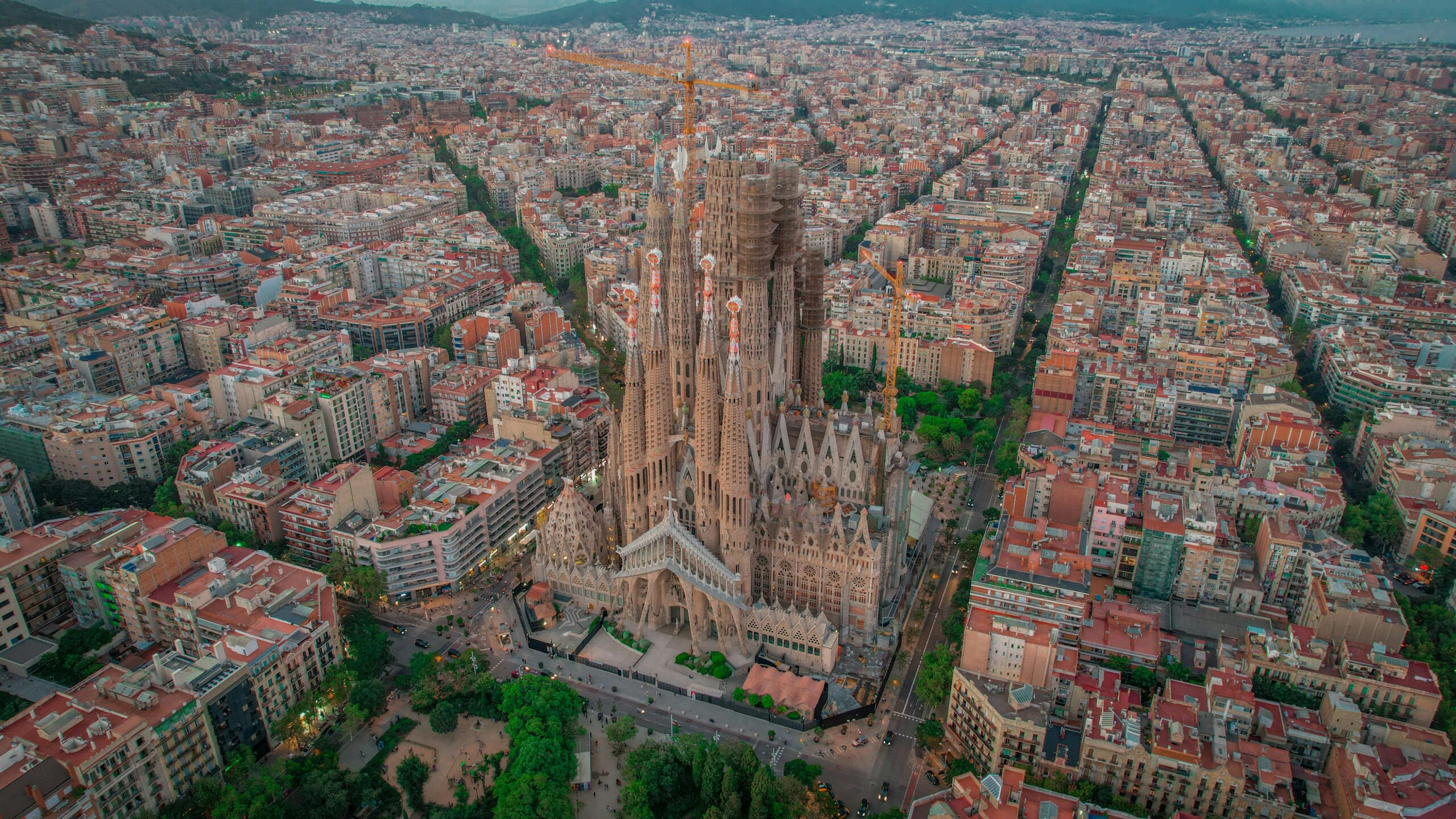 Stunning aerial photograph of the Sagrada Familia and cityscape in Barcelona, Spain.
